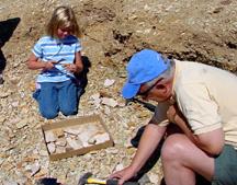 Summer and Dave collecting fossiles